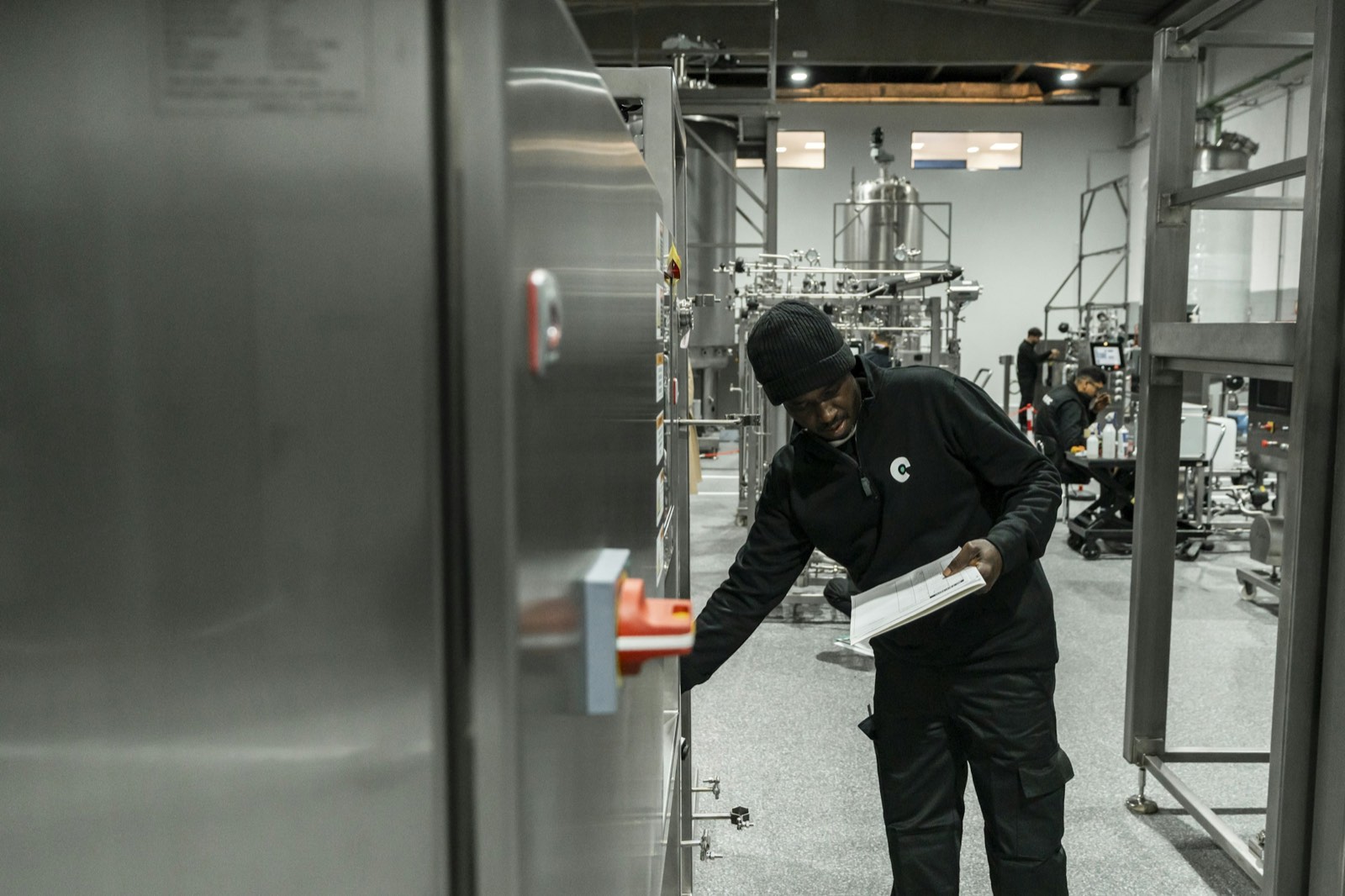 Engineer checking equipment in a plant